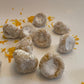 Pizzicotti Orange: Soft almond cookies over a white background