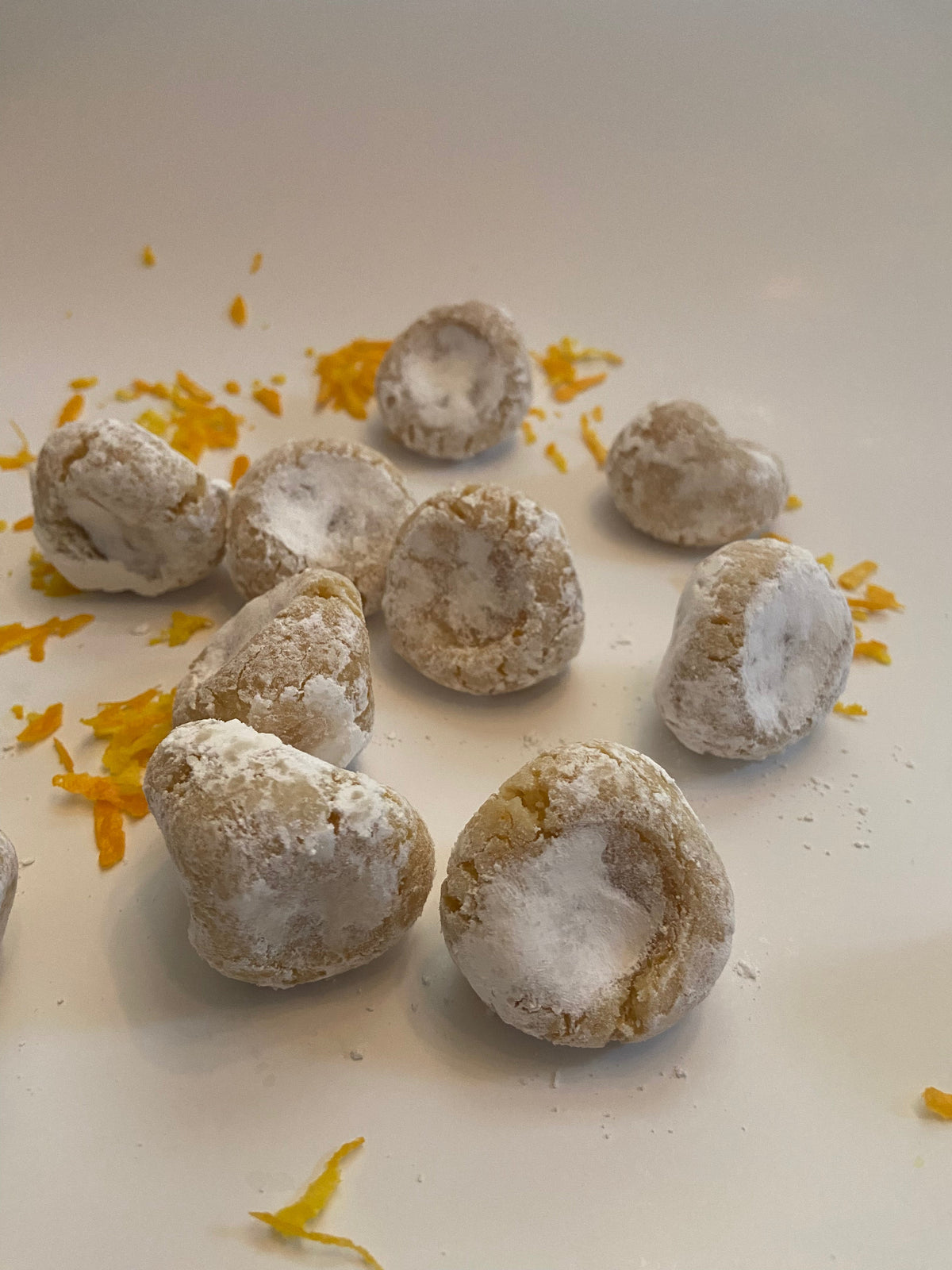 Pizzicotti Orange: Soft almond cookies over a white background