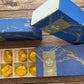 Pizzicotti open box with 8 golden wrapped Pizzicotti cookies