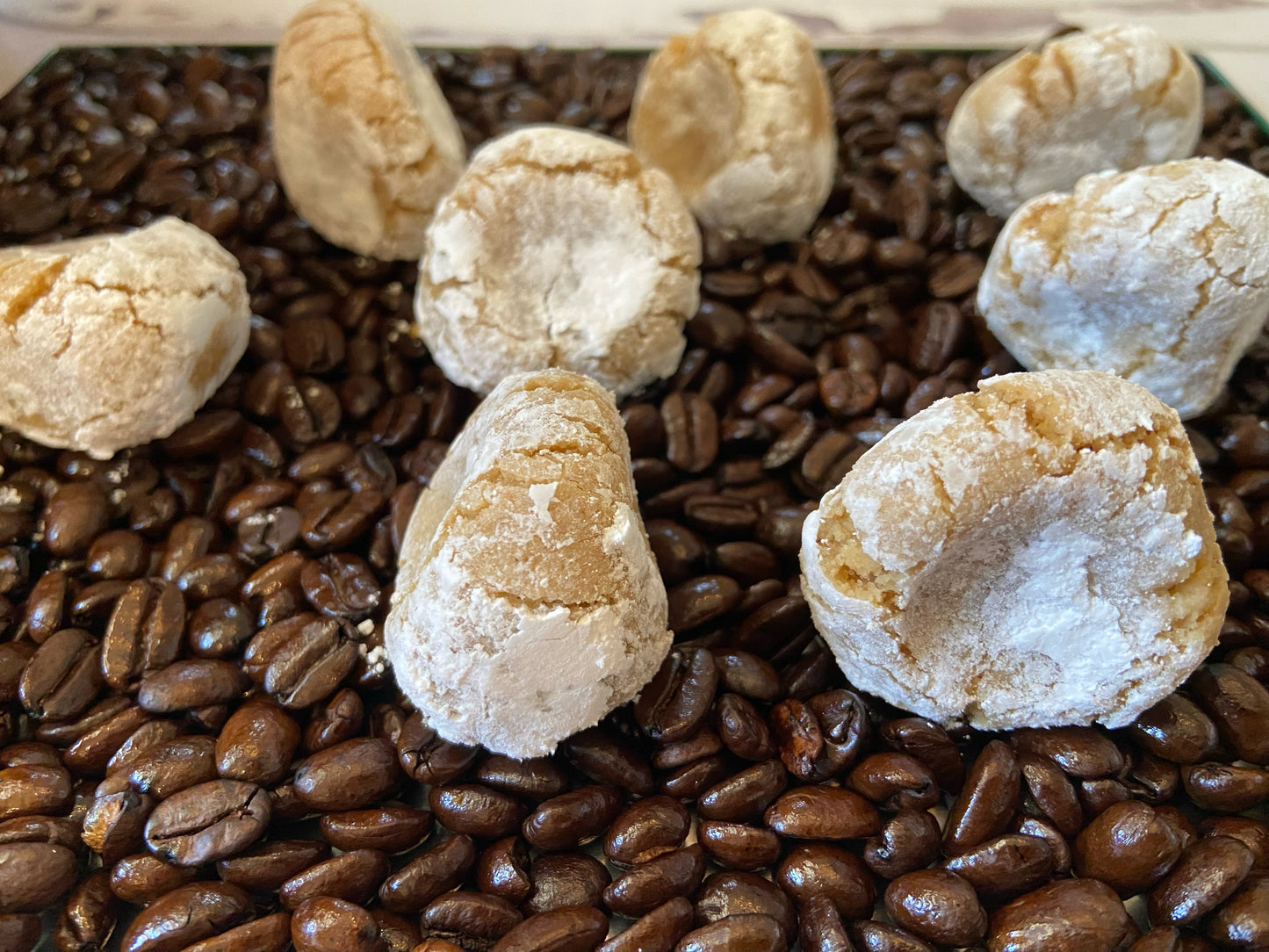 Pizzicotti: soft almond-coffee cookies sitting on coffee beans