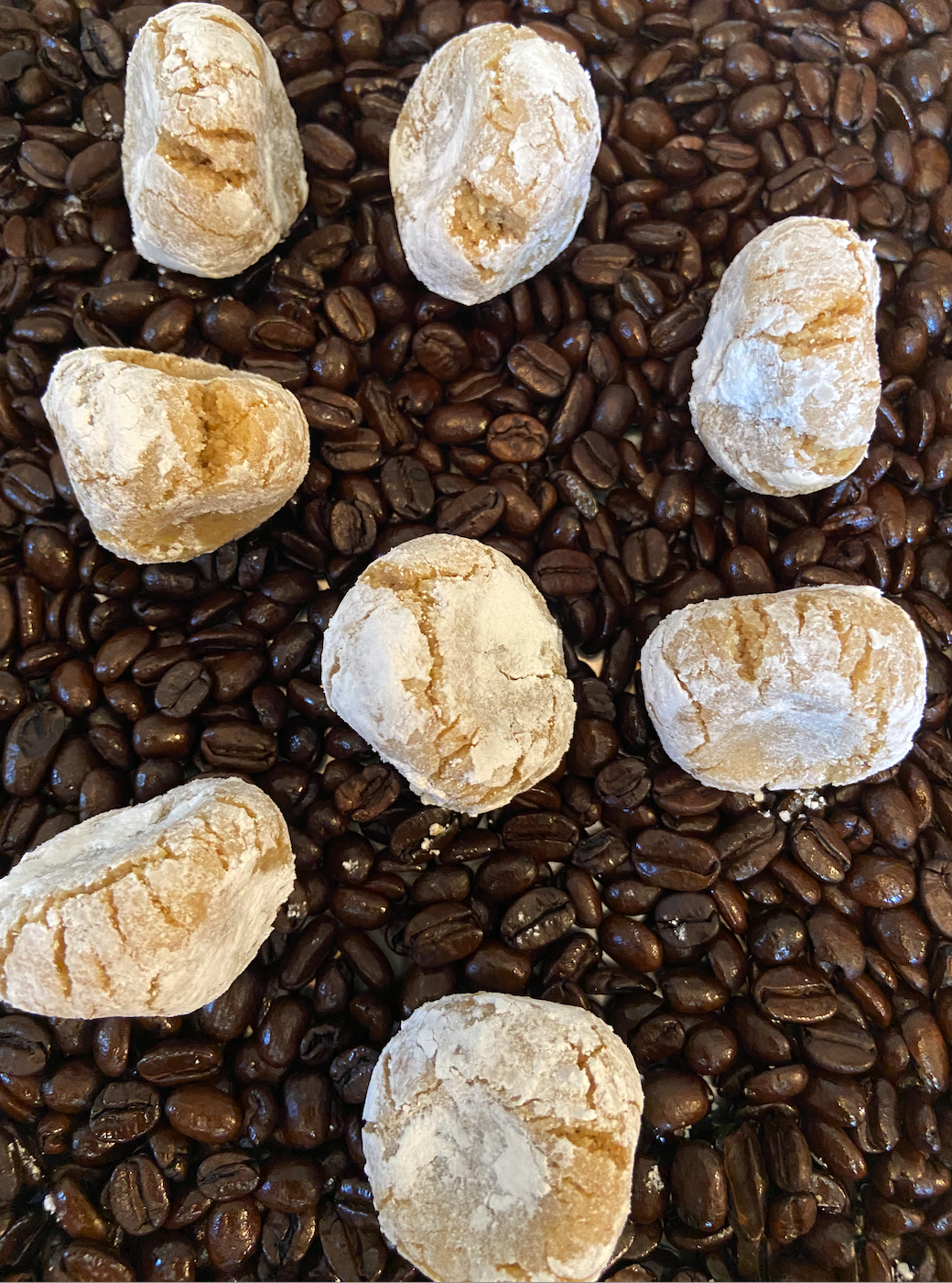 Soft almond and coffee cookies over coffee beans